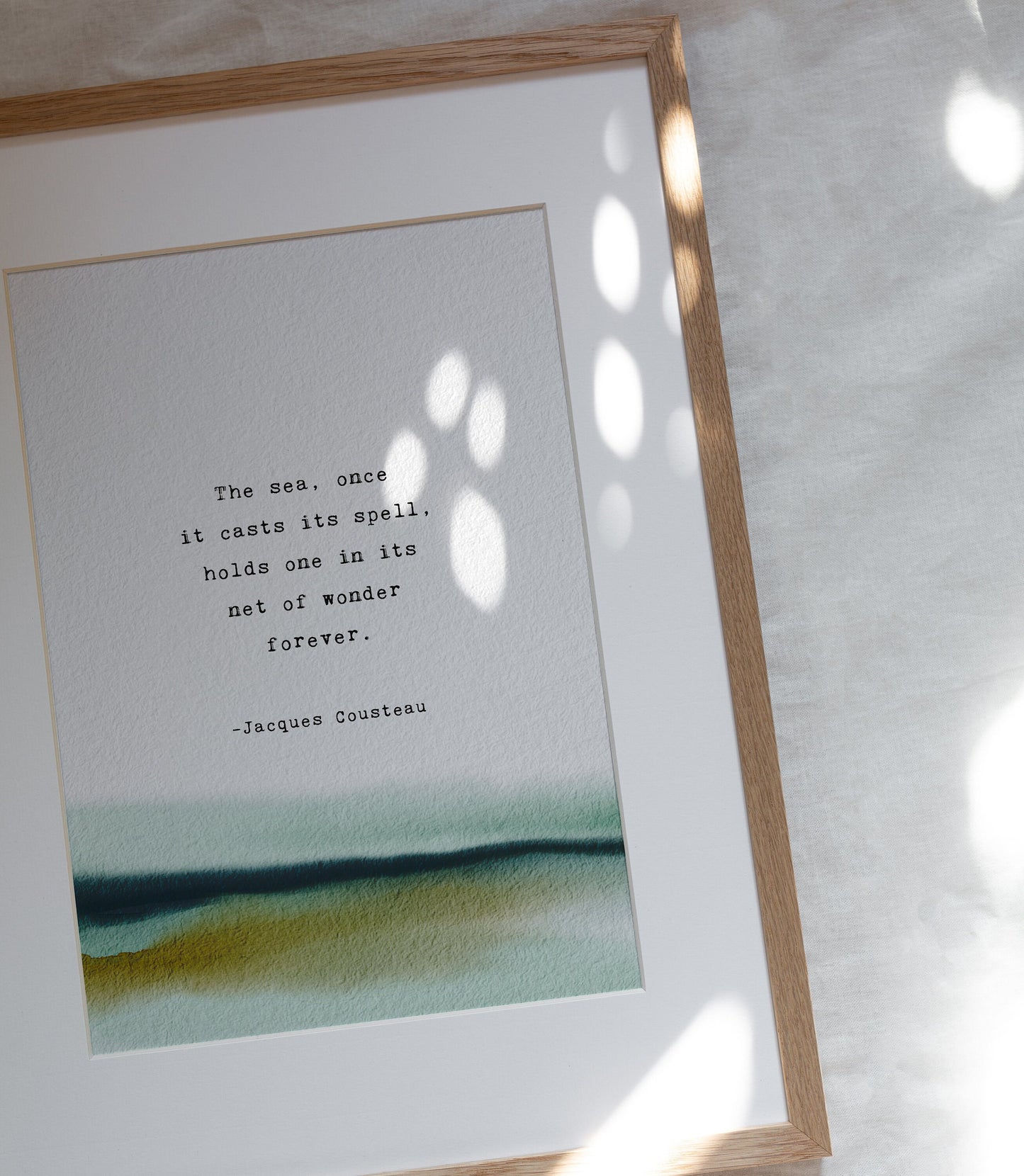 Jacques Cousteau quote print "The sea, once it casts its spell, holds one in its net of wonder forever". Watercolor art with quote.