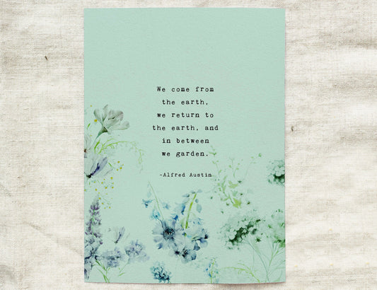 Flower wall art featuring a quote from Alfred Austin which says "we come from the earth, we return to the earth, and in between we garde. 